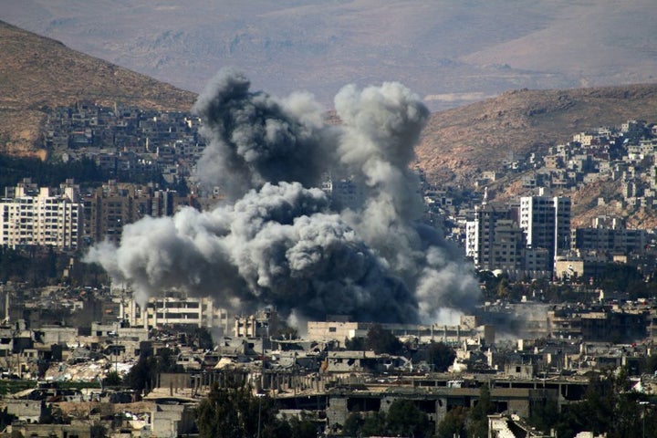 Smoke billows following reported air strikes by Syrian regime forces in the rebel-held area of Qabun, east of the capital Damascus, on March 6, 2017