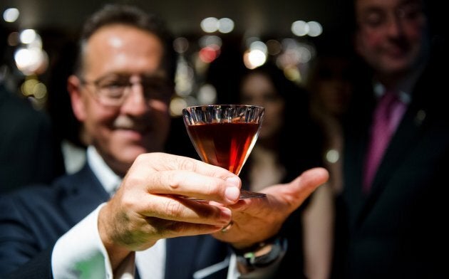 Salvatore Calabrese poses with a glass of his 'Salvatore's Legacy' cocktail, during an attempt to make the world's most expensive cocktail at 'Salvatore's Playboy Club' in London, England.