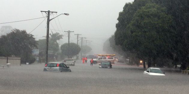 Cars caught in flood water in Albion Park Rail