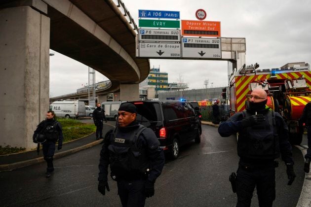 French Police unit (Raid) secure the area at Paris' Orly airport on March 18, 2017 following the shooting of a man by French security forces.Security forces at Paris' Orly airport shot dead a man who took a weapon from a soldier, the interior ministry said. Witnesses said the airport was evacuated following the shooting at around 8:30am (0730GMT). The man fled into a shop at the airport before he was shot dead, an interior ministry spokesman told AFP. He said there were no people were wounded in the incident. / AFP PHOTO / CHRISTOPHE SIMON (Photo credit should read CHRISTOPHE SIMON/AFP/Getty Images)