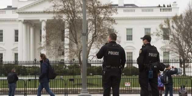 Members of the Secret Service Uniformed Divison patrol alongside the security fence around the perimeter of the White House in Washington, DC, March 18, 2017. (Photo credit should read SAUL LOEB/AFP/Getty Images)