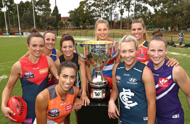 We're sure it's just a coincidence that Emma Zielke of the Lions and Chelsea Randall of the Crows are virtually obscured in this photo taken at the AFL Women's season launch in Melbourne.