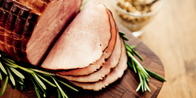 Smoked ham with rosemary and mustard. Selective focus.