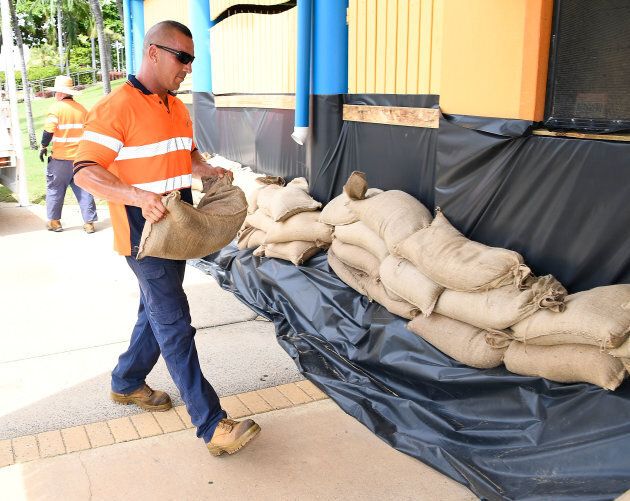 Local Townsville residents and council workers were sandbagging homes and businesses in Townsville on Sunday in preparation for Cyclone Debbie.