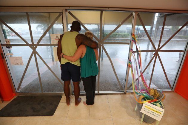 Local business owners Roger Matakamikamica and Tyler Matakamikamica watch Cyclone Debbie's approach in Bowen.