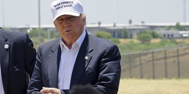 Republican presidential candidate Donald Trump attends a news conference near the U.S.-Mexico border (background), outside Laredo, Texas July 23, 2015. REUTERS/Rick Wilking