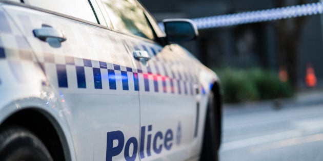 A man has allegedly assaulted paramedics assisting his pregnant partner.