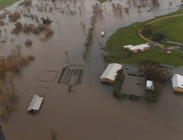 Damaged and flooded areas can be seen from an Australian Army helicopter after Cyclone Debbie passed...