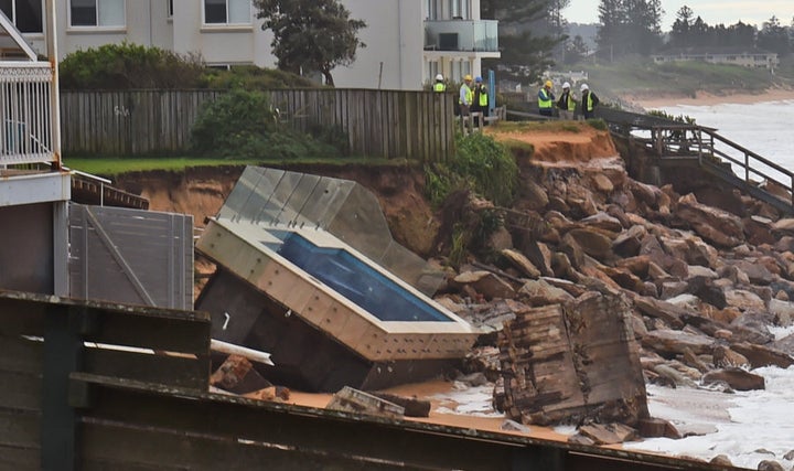 An inground pool sits amongst the rocks after a severe storm at Collaroy on Sydney's northern beaches on June 6, 2016.