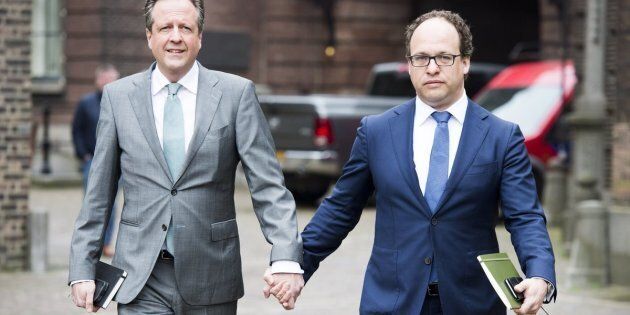 Dutch leader of the Democrats 66 (D66) party Alexander Pechtold (L) and Financial specialist of D66 party Wouter Koolmees (R) arrive for a meeting with other Dutch political parties, in The Hague, on April 3, 2017 while they hold hands as a sign of solidarity for two men who were physical abused after holding hands in public in Arnhem, on 1 April 2017. / AFP PHOTO / ANP / Lex van Lieshout / Netherlands OUT (Photo credit should read LEX VAN LIESHOUT/AFP/Getty Images)