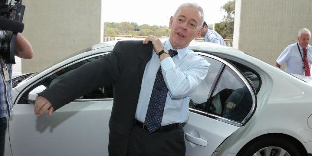 Former Family First Senator Bob Day puts his jacket on... to go home.
