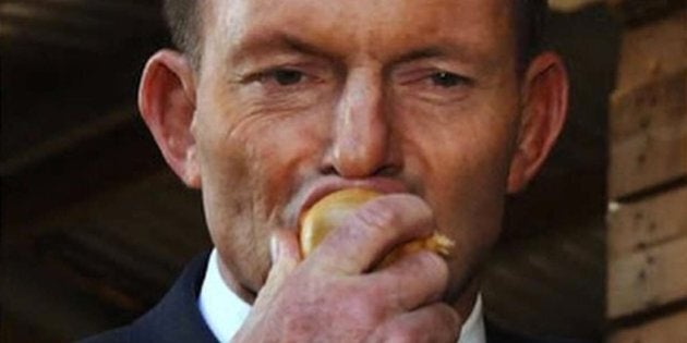 Tony Abbott eats a