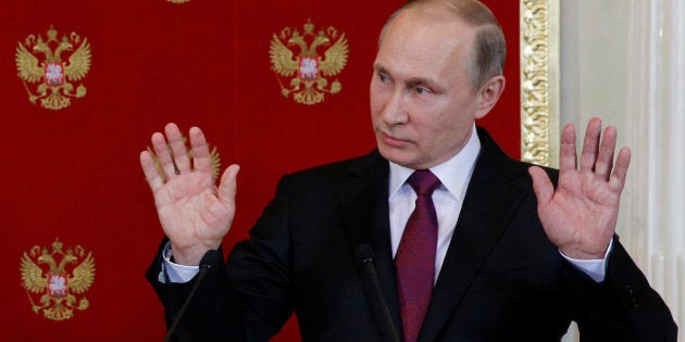 Russian President Vladimir Putin gestures during a joint news conference with Italian President Sergio Mattarella after their talks at the Kremlin in Moscow, Russia, April 11, 2017. REUTERS/Sergei Chirikov/Pool