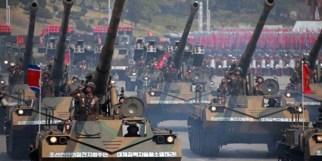 Korean People's howitzers are paraded through Kim Il-Sung square in Pyongyang.