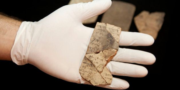 Letters inscribed on pottery, known as ostracons, which were unearthed in an excavation of a fort in Arad, Israel, and dated to about 600 B.C. shortly before Nebuchadnezzarâs destruction of Jerusalem, are seen in Israel Museum in Jerusalem Tuesday, April 12, 2016. A Tel Aviv University team determined that this famous hoard of ancient Hebrew inscriptions was written by at least six different authors. Although the inscriptions are not from the Bible, their discovery suggests there was widespread literacy in ancient Judah at the time that would support the composition of biblical works. (AP Photo/Dan Balilty)