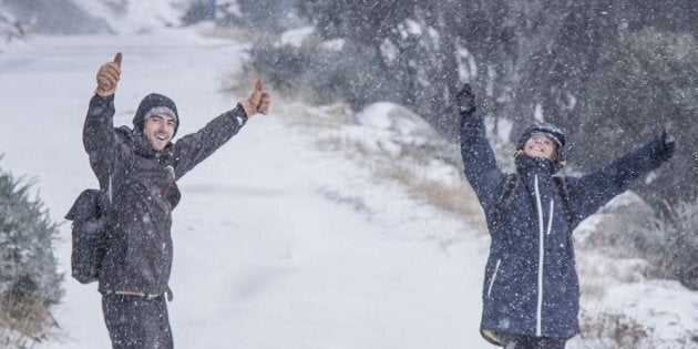 Revellers enjoy the snow