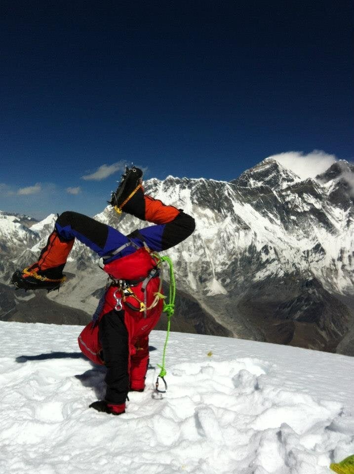 Di Westaway doing the world's highest handstand on the summit of Mt Ama Dablam, Nepal