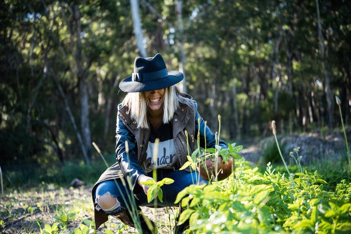 Monley tends her farm's organic produce garden at Berrima.