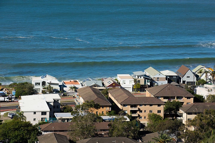 The row of homes is now right on the water, and the main road is right after that.