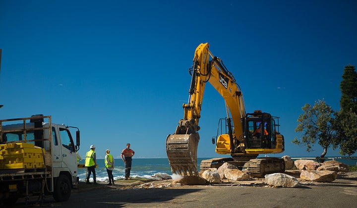 Council, SES and police are working to temporarily shore up waterfront homes.