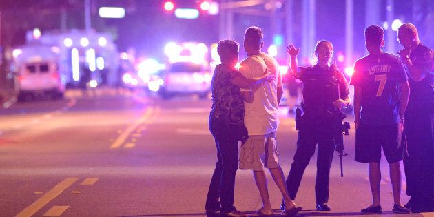 Orlando Police direct family members away from a multiple shooting at a nightclub in Orlando, Florida.