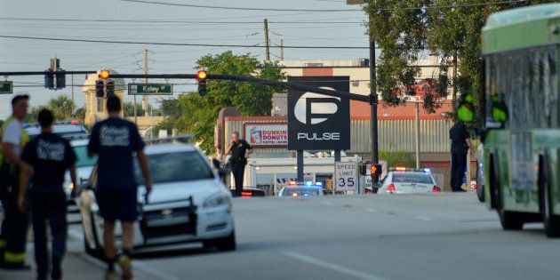 Police lock down Orange Avenue around Pulse nightclub, where people were killed by a gunman in a shooting rampage in Orlando, Florida June 12, 2016. REUTERS/Kevin Kolczynski