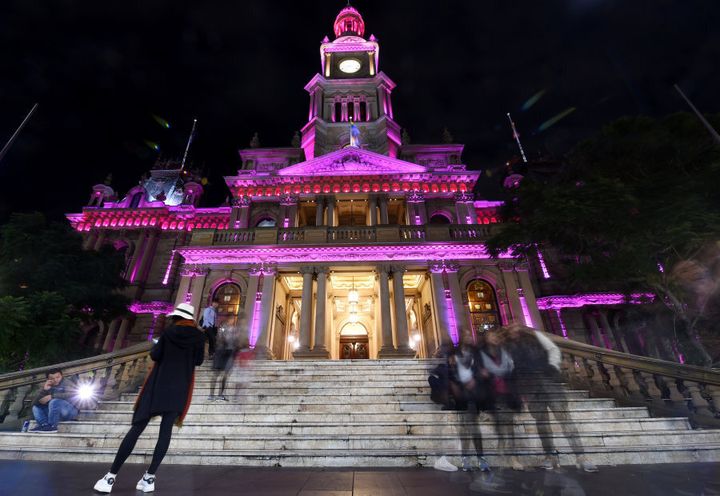 Sydney's Town Hall is illuminated pink in memory of the victims of the Orlando nightclub mass shooting.