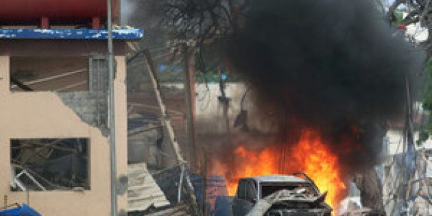 A vehicle burns at the scene of a suicide bomb attack outside Nasahablood hotel in Somalia's capital Mogadishu, June 25, 2016.