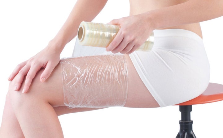 Plastic wrap should be applied to the burn after running it under cold water.