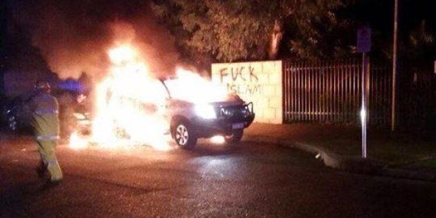 A Toyota Prado burns outside the Thornlie Mosque in WA in what is believed to be a suspected petrol bombing.