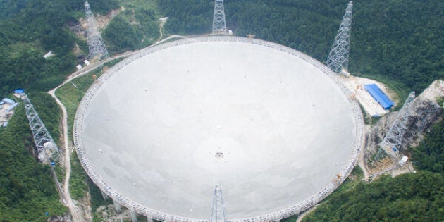 Construction on the Five-hundred-meter Aperture Spherical Telescope, or FAST, began in 2011. Workers installed the last of 4,450 panels on Sunday and operations are scheduled to begin in September.