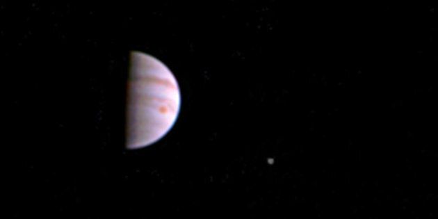Jupiter and its Great Red Spot can be seen in this first image released by NASA. From left to right, the moons Io, Europa and Ganymede can also be seen.