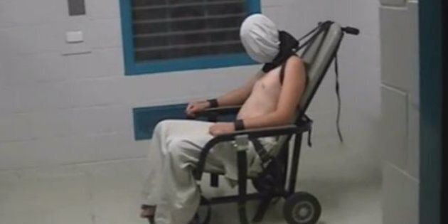 A teenage boy pictured strapped to a chair in the NT Don Dale centre