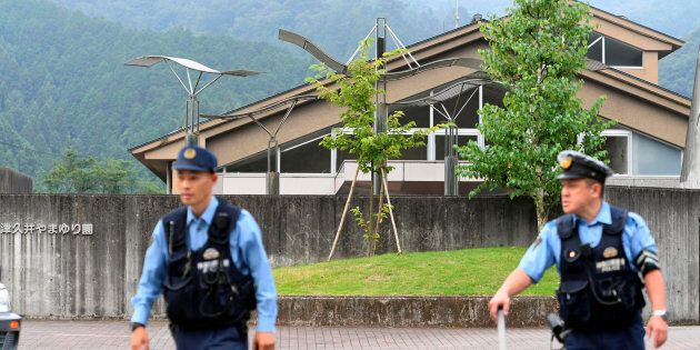 Police officers in front of the facility for the disabled where 19 people were killed and 25 wounded by a knife-wielding man, in Sagamihara, Kanagawa prefecture, Japan.
