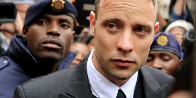 Olympic and Paralympic track star Oscar Pistorius leaves court after appearing for the 2013 killing of his girlfriend Reeva Steenkamp in the North Gauteng High Court in Pretoria, South Africa.