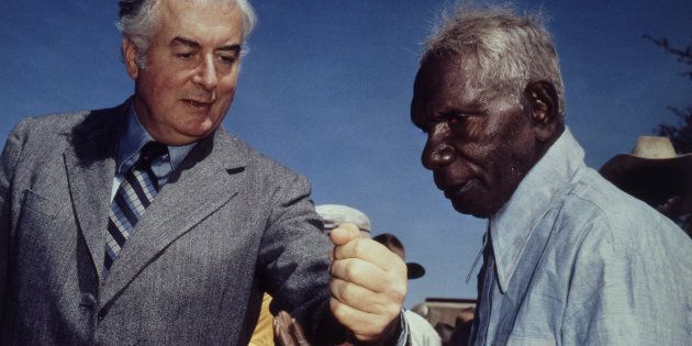 Prime Minister Gough Whitlam pours soil into the hands of traditional landowner Vincent Lingiari, Northern Territory on August 17, 1975.