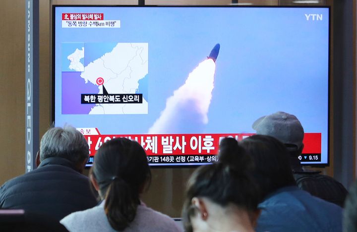 People watch a TV showing file footage of North Korea's missile launch during a news program at the Seoul Railway Station in Seoul, South Korea, Thursday, May 9, 2019. (AP Photo/Ahn Young-joon)