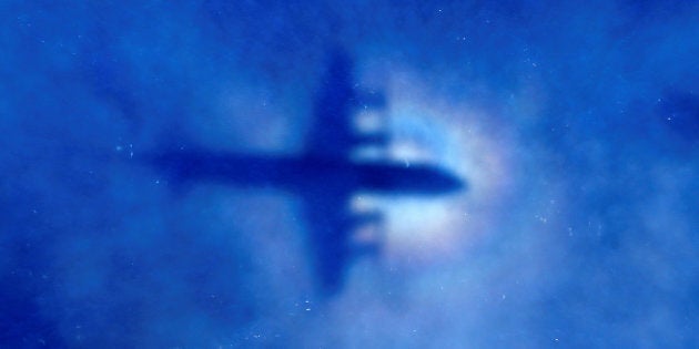 FILE PHOTO: The shadow of a Royal New Zealand Air Force (RNZAF) P3 Orion maritime search aircraft can be seen on low-level clouds as it flies over the southern Indian Ocean looking for missing Malaysian Airlines flight MH370 March 31, 2014. REUTERS/Rob Griffith/Pool/File photo TPX IMAGES OF THE DAY