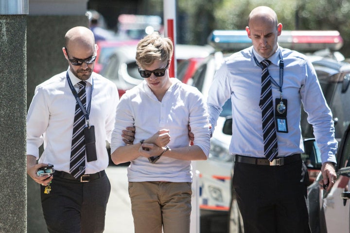 Suspects in the Tiahleigh Palmer murder investigation arrive under arrest at Logan Police Station on September 20, 2016 in Brisbane