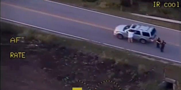 A still image captured from a video from Tulsa Police Department shows Terence Crutcher seen with his hands in the air during a police shooting incident in Tulsa, Oklahoma, U.S. on September 16, 2016. Video taken September 16, 2016. Courtesy Tulsa Police Department/Handout via REUTERS ATTENTION EDITORS - THIS IMAGE WAS PROVIDED BY A THIRD PARTY. EDITORIAL USE ONLY