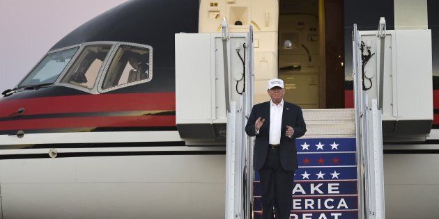 Republican presidential nominee Donald Trump steps out of his plane for a rally at the JetCenters of Colorado in Colorado Springs, Colorado on September 17, 2016. / AFP / MANDEL NGAN (Photo credit should read MANDEL NGAN/AFP/Getty Images)