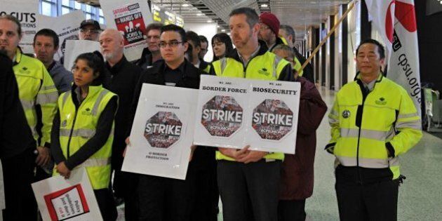 Workers at Melbourne Airport stop work earlier this year