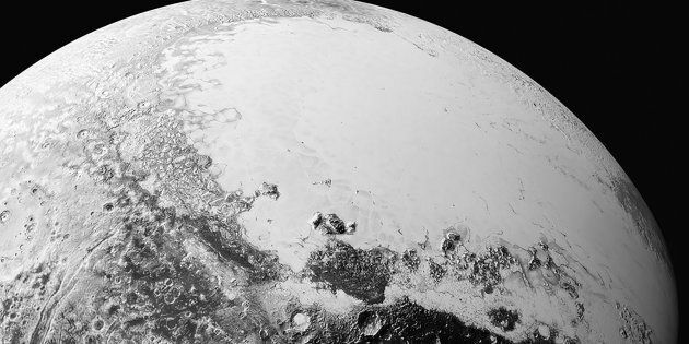 A synthetic perspective view of Pluto, based on the latest high-resolution images to be downlinked from NASA's New Horizons spacecraft, shows what you would see if you were approximately 1,100 miles (1,800 kilometers) above Pluto's equatorial area, looking toward the bright, smooth, expanse of icy plains informally called Sputnik Planum, in this image taken July 14, 2015 and released September 10, 2015. The images were taken as New Horizons flew past Pluto from a distance of 50,000 miles (80,000 kilometers). REUTERS/NASA/Handout via Reuters
