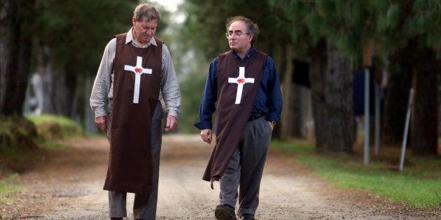 William Kamm (right) in the garb of his order in 2000.