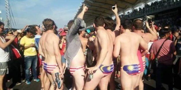 Nine Australians, including Jack Walker, a staffer to minister Christopher Pyne were arrested in Malaysia after stripping to show off Malaysian flag underwear.