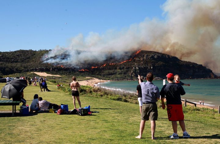 Aussies look on as a fire breaks out in 2013 at Sydney's Palm Beach.