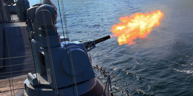 The Chinese frigate 'Guangzhou' fires secondary guns during a China-Russia naval joint drill at sea off south China's Guangdong Province, on Sept. 18, 2016.