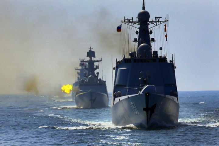 Chinese and Russian fleets fire main guns during a China-Russia naval joint drill at sea off south China's Guangdong Province, on September 18