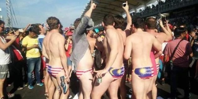 The men raised the ire of Malaysian authorities after they stripped down to celebrate an F1 win in the conservative Muslim nation.