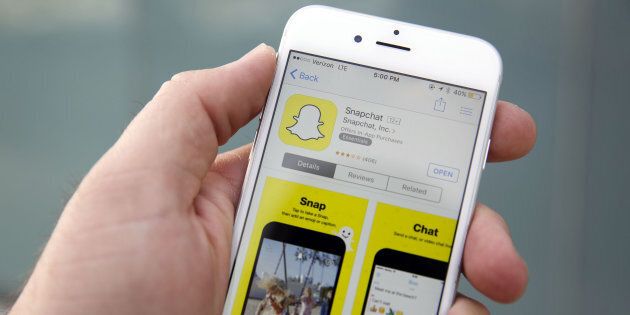 The Snapchat Inc. application is displayed in the App Store on an Apple Inc. iPhone 6 in this arranged photograph taken in the Venice Beach neighborhood of Los Angeles, California, U.S., on Wednesday, March 2, 2016. People using the application for disappearing photos view 8 billion videos a day, the same number that Facebook reports, the CEO Evan Spiegel told an audience at the Morgan Stanley technology conference Photographer: Patrick T. Fallon/Bloomberg via Getty Images
